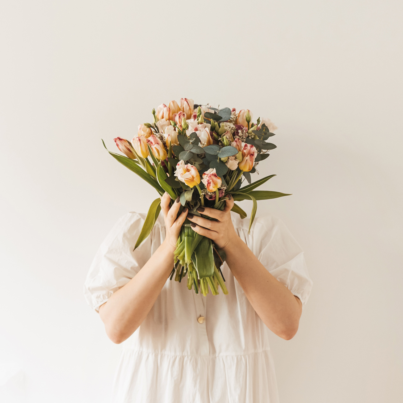 Girl In White Dress Holding Flower Bouquet